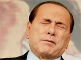 Берлускони приговорен к четырем годам тюрьмы